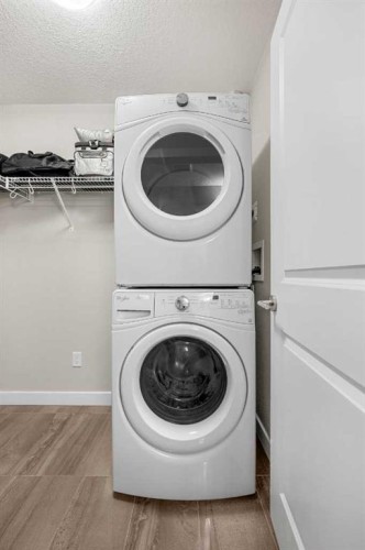 1412-3727 Sage Hill Drive Nw, Calgary, AB - Indoor Photo Showing Laundry Room