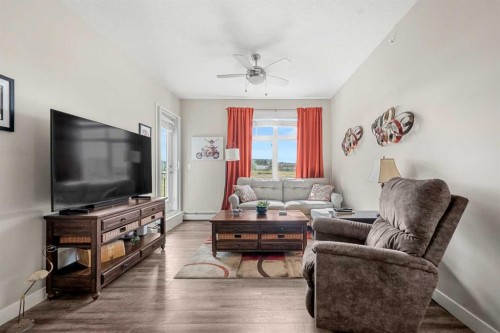 1412-3727 Sage Hill Drive Nw, Calgary, AB - Indoor Photo Showing Living Room