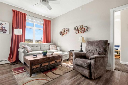 1412-3727 Sage Hill Drive Nw, Calgary, AB - Indoor Photo Showing Living Room
