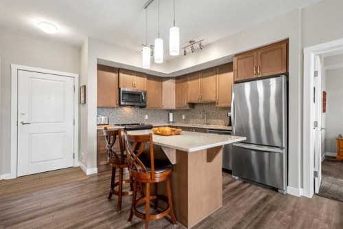 1412-3727 Sage Hill Drive Nw, Calgary, AB - Indoor Photo Showing Kitchen With Stainless Steel Kitchen With Upgraded Kitchen