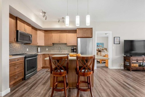 1412-3727 Sage Hill Drive Nw, Calgary, AB - Indoor Photo Showing Kitchen With Stainless Steel Kitchen With Upgraded Kitchen