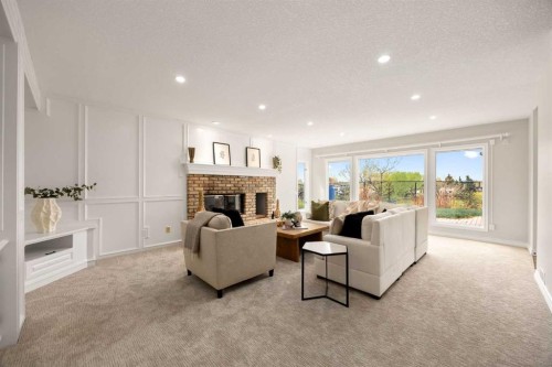 21 Douglas Woods Manor Se, Calgary, AB - Indoor Photo Showing Living Room With Fireplace