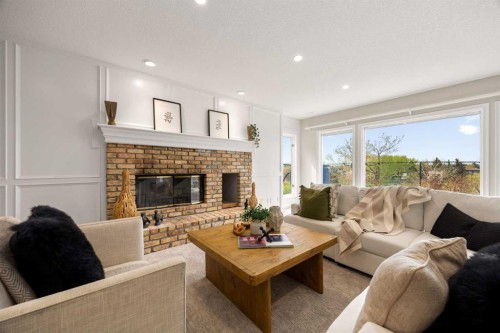 21 Douglas Woods Manor Se, Calgary, AB - Indoor Photo Showing Living Room With Fireplace