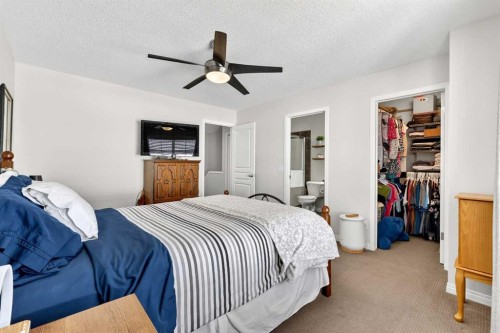 312 New Brighton Villas Se, Calgary, AB - Indoor Photo Showing Bedroom