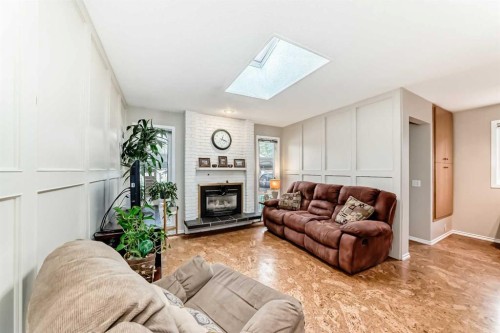308 Cannington Place Sw, Calgary, AB - Indoor Photo Showing Living Room With Fireplace