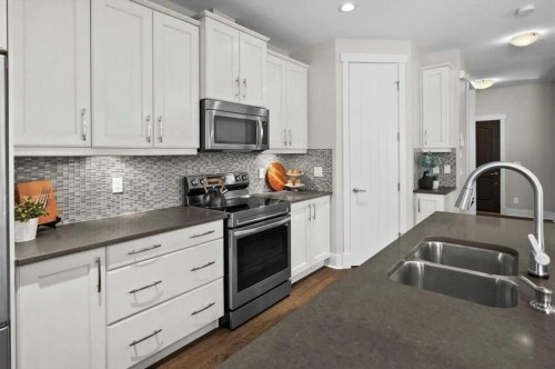 2330 25 Avenue Nw, Calgary, AB - Indoor Photo Showing Kitchen With Stainless Steel Kitchen With Double Sink With Upgraded Kitchen