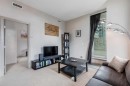 205-210 15 Avenue Se, Calgary, AB  - Indoor Photo Showing Living Room 