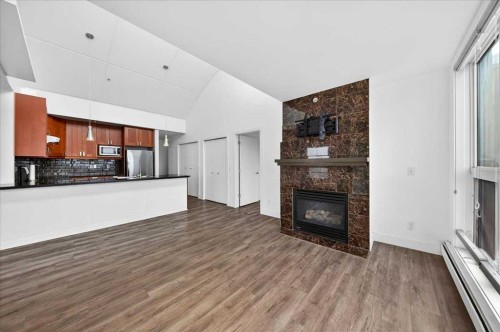 404-603 7 Avenue Ne, Calgary, AB - Indoor With Fireplace