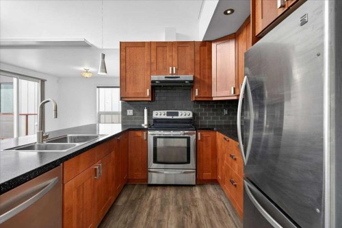 404-603 7 Avenue Ne, Calgary, AB - Indoor Photo Showing Kitchen With Double Sink With Upgraded Kitchen