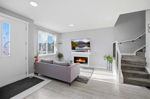 668 Cornerstone Boulevard Ne, Calgary, AB - Indoor With Fireplace