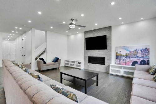 248 Sandpiper Boulevard, Chestermere, AB - Indoor Photo Showing Living Room With Fireplace