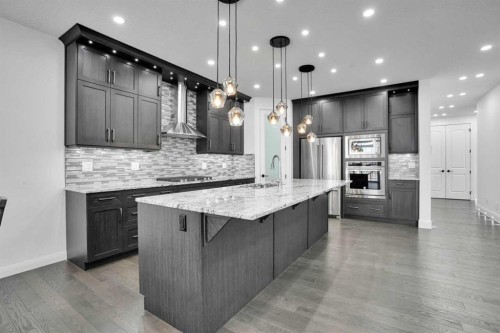 248 Sandpiper Boulevard, Chestermere, AB - Indoor Photo Showing Kitchen With Upgraded Kitchen