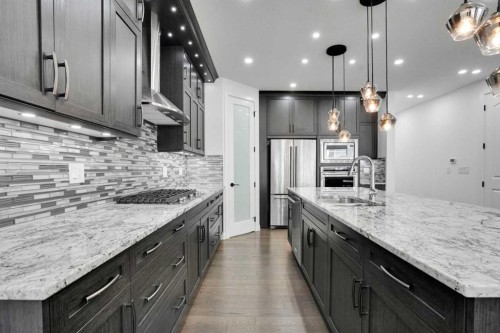 248 Sandpiper Boulevard, Chestermere, AB - Indoor Photo Showing Kitchen With Upgraded Kitchen