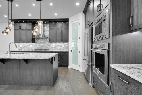 248 Sandpiper Boulevard, Chestermere, AB - Indoor Photo Showing Kitchen With Upgraded Kitchen