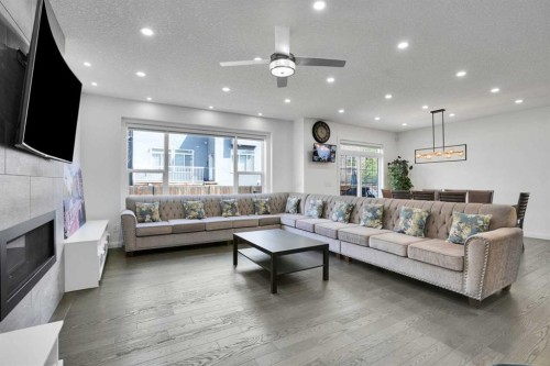 248 Sandpiper Boulevard, Chestermere, AB - Indoor Photo Showing Living Room With Fireplace