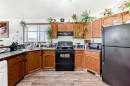 92 Everstone Rise Sw, Calgary, AB  - Indoor Photo Showing Kitchen With Double Sink 