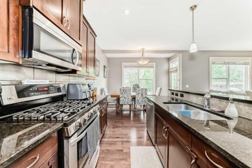 228 Cranston Drive Se, Calgary, AB - Indoor Photo Showing Kitchen With Double Sink
