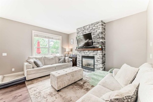 228 Cranston Drive Se, Calgary, AB - Indoor Photo Showing Living Room With Fireplace
