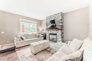 228 Cranston Drive Se, Calgary, AB  - Indoor Photo Showing Living Room With Fireplace 
