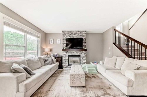 228 Cranston Drive Se, Calgary, AB - Indoor Photo Showing Living Room With Fireplace