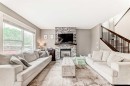 228 Cranston Drive Se, Calgary, AB  - Indoor Photo Showing Living Room With Fireplace 