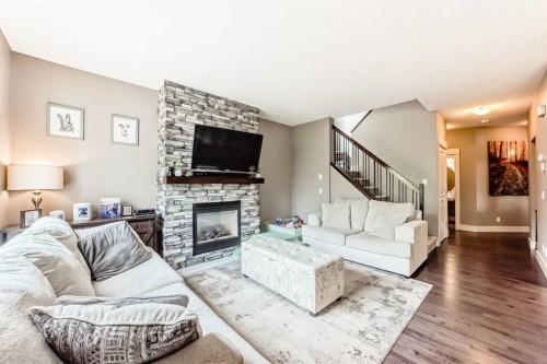 228 Cranston Drive Se, Calgary, AB - Indoor Photo Showing Living Room With Fireplace