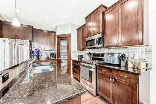 228 Cranston Drive Se, Calgary, AB - Indoor Photo Showing Kitchen With Double Sink With Upgraded Kitchen