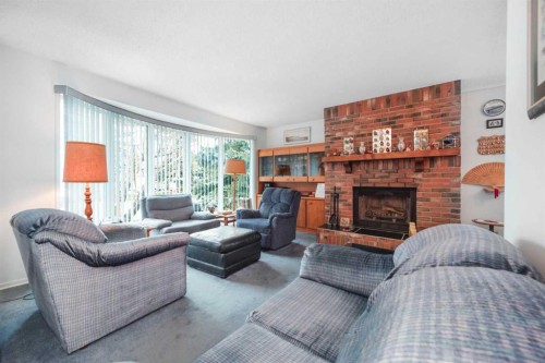 3623 54 Avenue Sw, Calgary, AB - Indoor Photo Showing Living Room With Fireplace