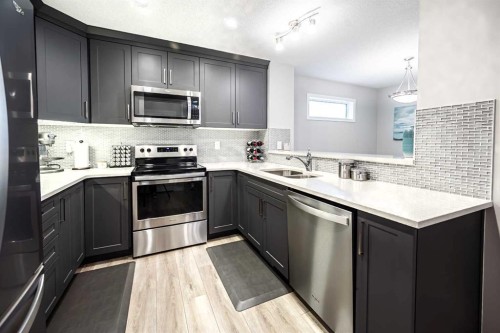 1460 Carrington Boulevard Nw, Calgary, AB - Indoor Photo Showing Kitchen With Stainless Steel Kitchen With Double Sink With Upgraded Kitchen