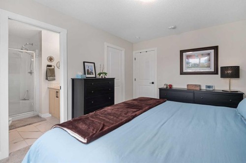 315 Wolf Creek Way Se, Calgary, AB - Indoor Photo Showing Bedroom