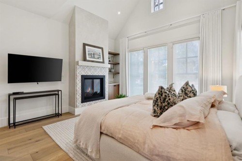 1119 Riverdale Avenue Sw, Calgary, AB - Indoor Photo Showing Bedroom With Fireplace