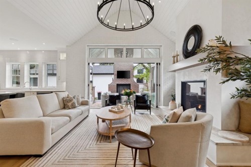 1119 Riverdale Avenue Sw, Calgary, AB - Indoor Photo Showing Living Room With Fireplace
