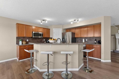 130 Morningside Point Sw, Airdrie, AB - Indoor Photo Showing Kitchen With Upgraded Kitchen