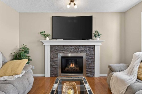 130 Morningside Point Sw, Airdrie, AB - Indoor Photo Showing Living Room With Fireplace
