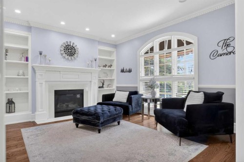 22 Ridge Pointe, Heritage Pointe, AB - Indoor Photo Showing Living Room With Fireplace
