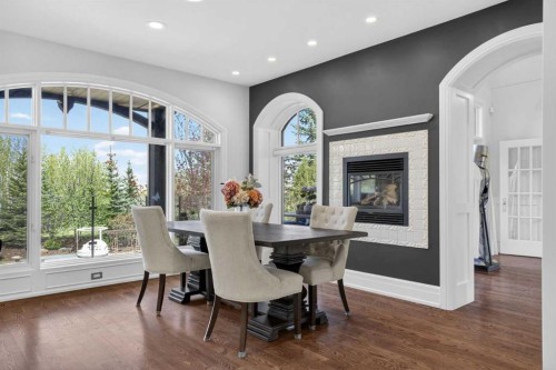 22 Ridge Pointe, Heritage Pointe, AB - Indoor Photo Showing Dining Room With Fireplace