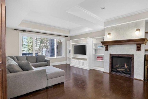 22 Ridge Pointe, Heritage Pointe, AB - Indoor Photo Showing Living Room With Fireplace