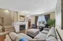 44 Mike Ralph Way Sw, Calgary, AB  - Indoor Photo Showing Living Room With Fireplace 