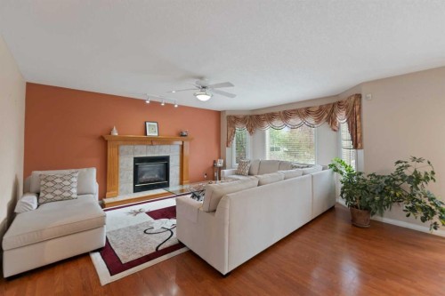 434 Douglas Woods Mews Se, Calgary, AB - Indoor Photo Showing Living Room With Fireplace