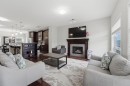 22 Redstone Road Ne, Calgary, AB  - Indoor Photo Showing Living Room With Fireplace 
