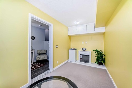 109 Redstone Circle Ne, Calgary, AB - Indoor Photo Showing Other Room With Fireplace