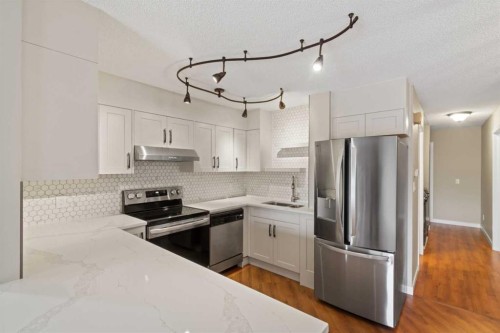 1402-13104 Elbow Drive Sw, Calgary, AB - Indoor Photo Showing Kitchen With Stainless Steel Kitchen With Upgraded Kitchen