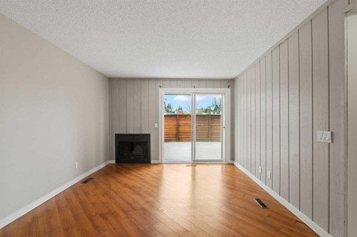 1402-13104 Elbow Drive Sw, Calgary, AB - Indoor With Fireplace