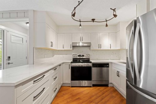 1402-13104 Elbow Drive Sw, Calgary, AB - Indoor Photo Showing Kitchen With Stainless Steel Kitchen With Upgraded Kitchen