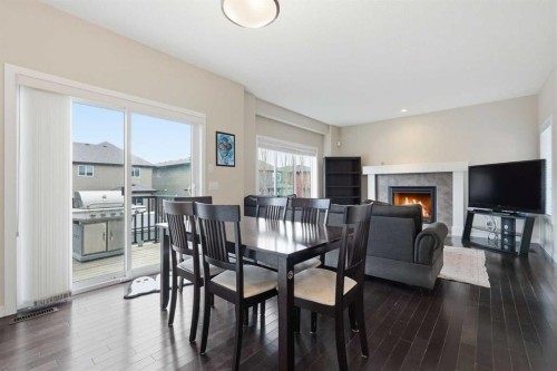 31 Evansridge Crescent Nw, Calgary, AB - Indoor Photo Showing Dining Room With Fireplace