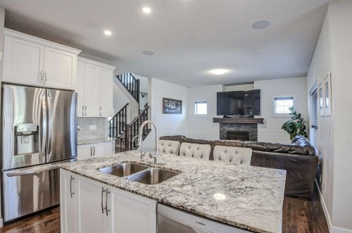 29 Drake Landing Loop, Okotoks, AB - Indoor Photo Showing Kitchen With Stainless Steel Kitchen With Double Sink With Upgraded Kitchen