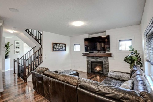 29 Drake Landing Loop, Okotoks, AB - Indoor Photo Showing Living Room With Fireplace
