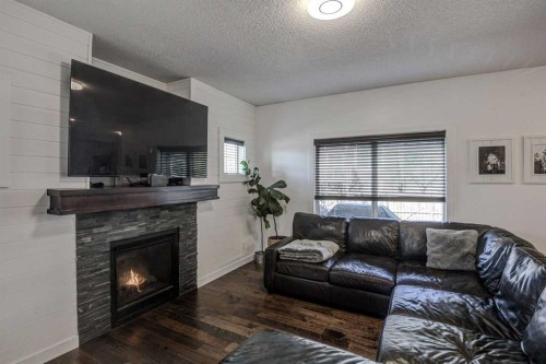 29 Drake Landing Loop, Okotoks, AB - Indoor Photo Showing Living Room With Fireplace