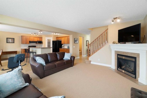249 Springmere Way, Chestermere, AB - Indoor Photo Showing Living Room With Fireplace