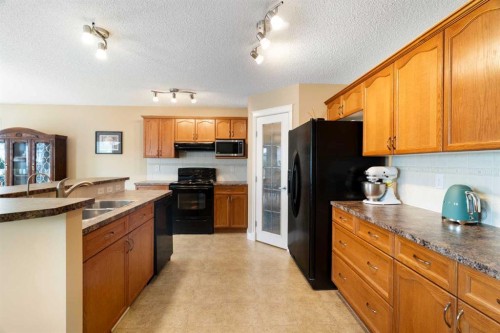 249 Springmere Way, Chestermere, AB - Indoor Photo Showing Kitchen With Double Sink
